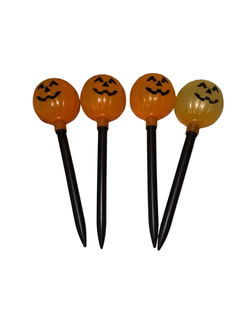 Four vintage blow mold pumpkin garden stakes